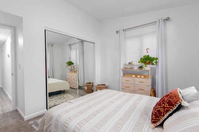 carpeted bedroom featuring a closet