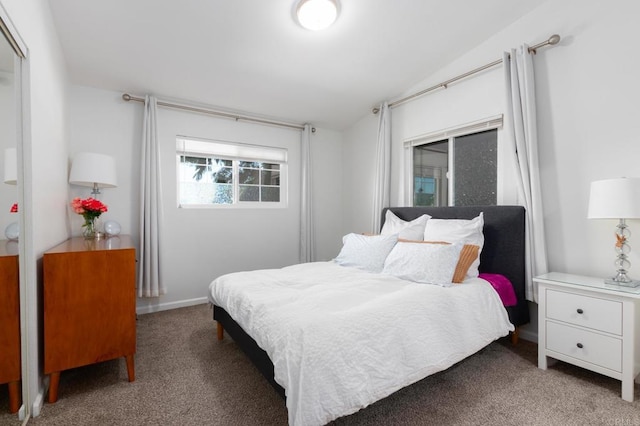 carpeted bedroom featuring vaulted ceiling