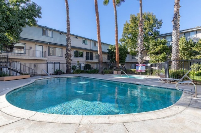 view of swimming pool featuring a patio area