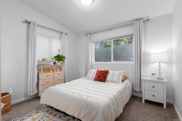 carpeted bedroom with vaulted ceiling