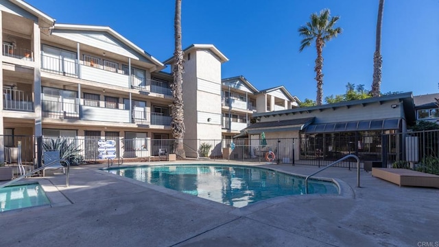 view of swimming pool with a patio area