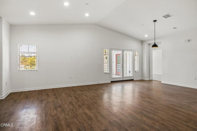 unfurnished room with lofted ceiling and dark hardwood / wood-style floors