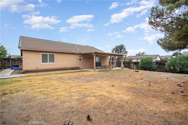 rear view of property featuring a patio