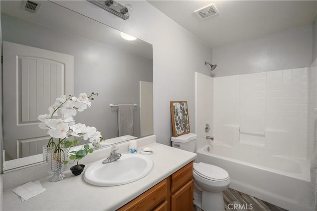 full bathroom featuring vanity, toilet, and  shower combination