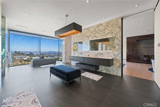 bedroom with hardwood / wood-style floors and expansive windows