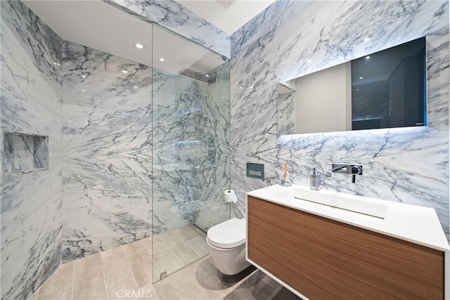 bathroom featuring toilet, a shower, tile walls, and vanity