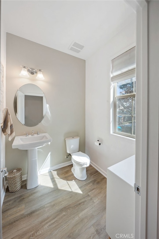 20 Jaripol Cir, Rancho Mission Viejo, CA 92694 - bathroom with visible vents, toilet, baseboards, and wood finished floors