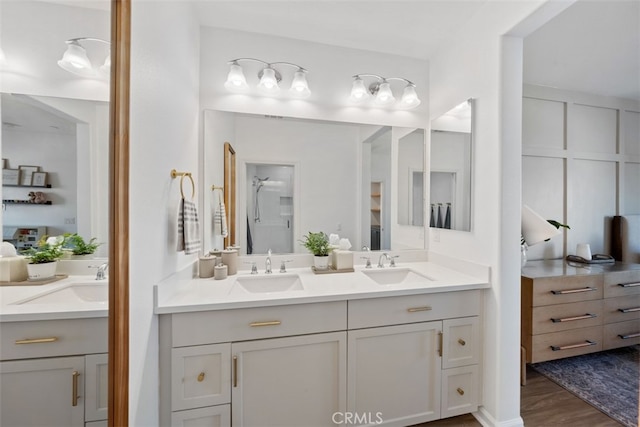 20 Jaripol Cir, Rancho Mission Viejo, CA 92694 - bathroom featuring double vanity, wood finished floors, and a sink