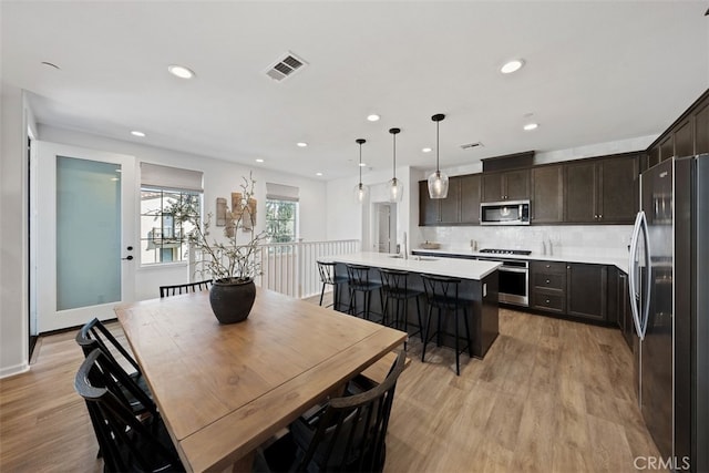 20 Jaripol Cir, Rancho Mission Viejo, CA 92694 - dining room featuring recessed lighting, visible vents, baseboards, and light wood-style flooring
