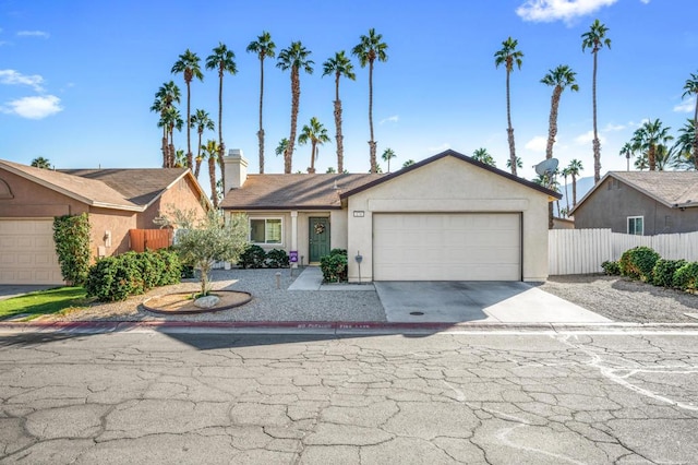 ranch-style home featuring a garage