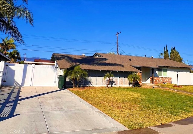 ranch-style house with a front lawn