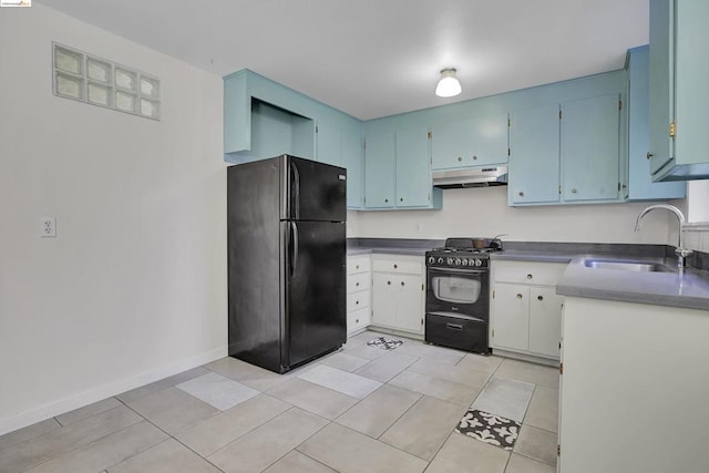 kitchen featuring black appliances, light tile patterned floors, sink, and blue cabinetry