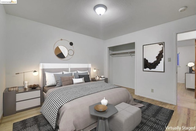 bedroom featuring a closet and light wood-type flooring