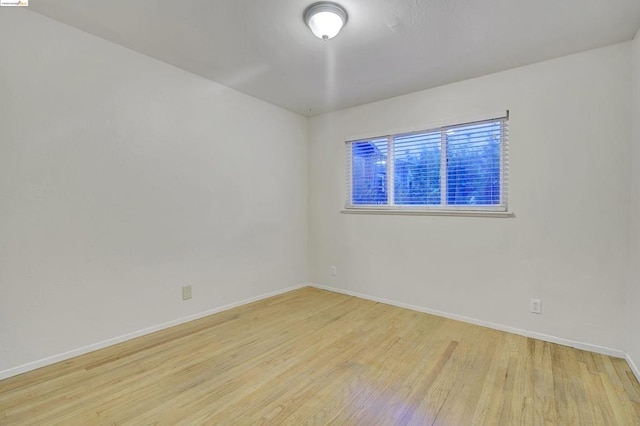 spare room with light wood-type flooring