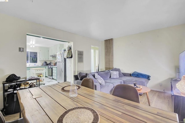 dining room with light wood-type flooring