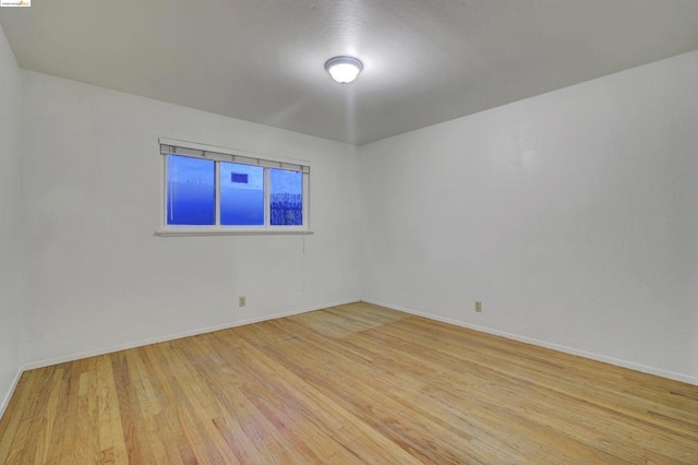 empty room with light wood-type flooring