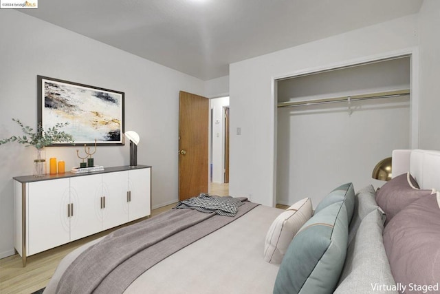 bedroom featuring a closet and light hardwood / wood-style flooring