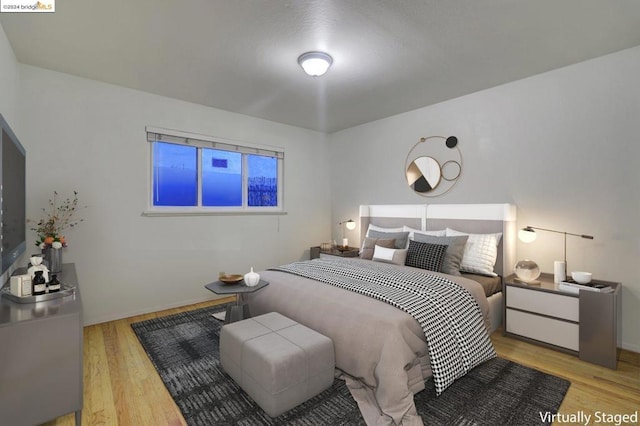 bedroom featuring light hardwood / wood-style flooring