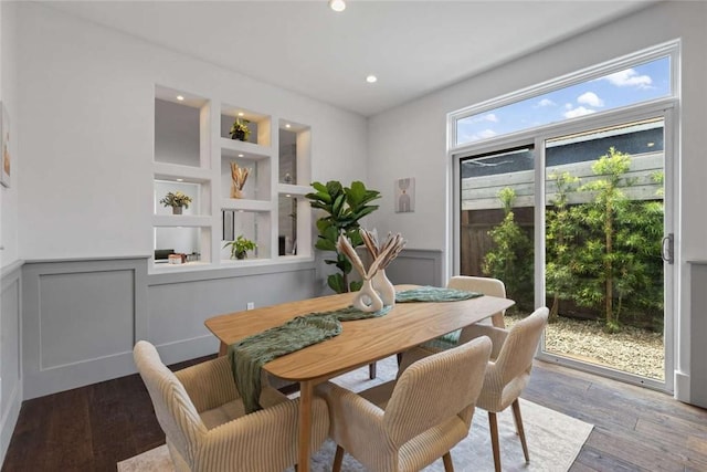 dining area with hardwood / wood-style floors