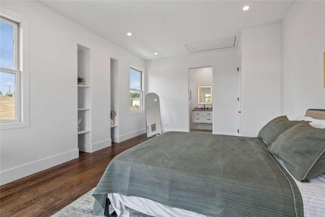 bedroom featuring multiple windows and dark wood-type flooring