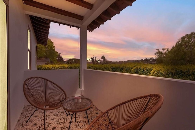 view of balcony at dusk