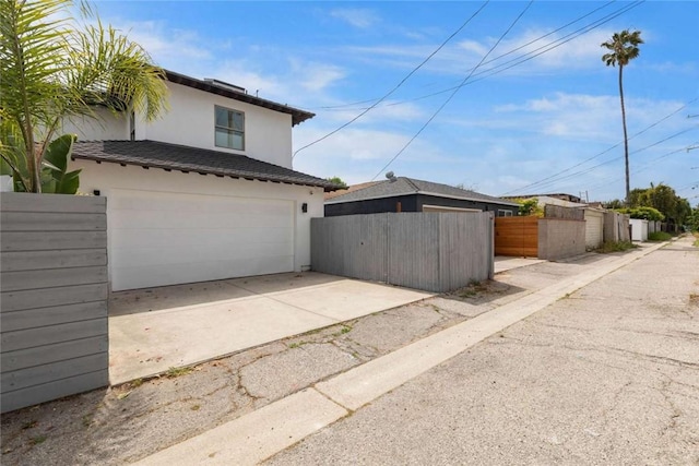 view of side of property with a garage