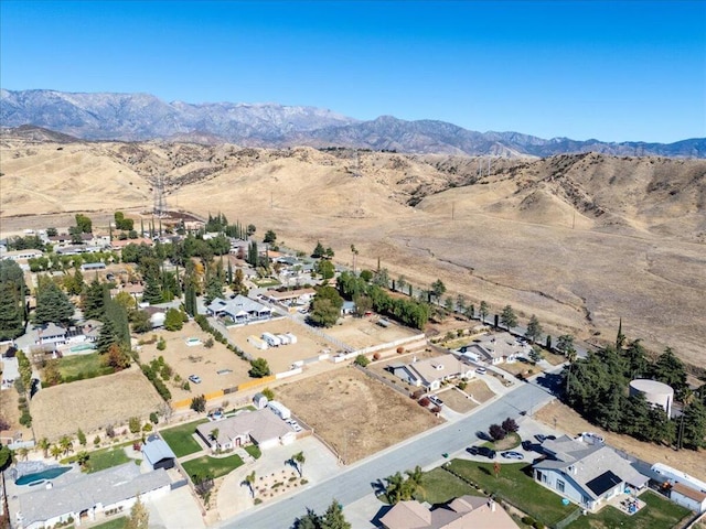 birds eye view of property featuring a mountain view