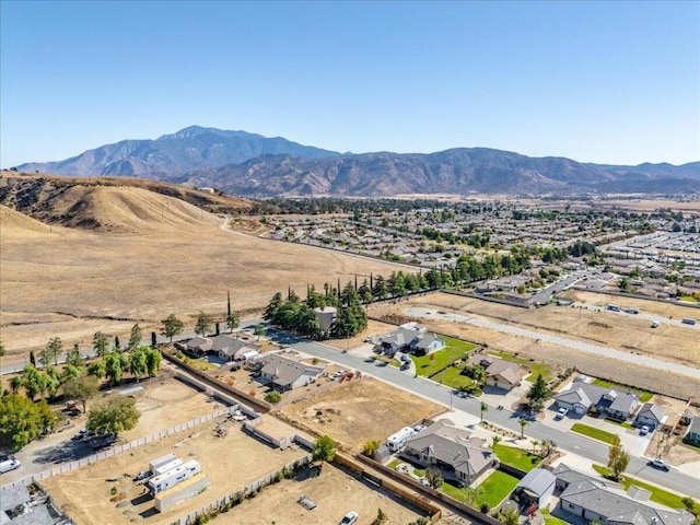 birds eye view of property with a mountain view