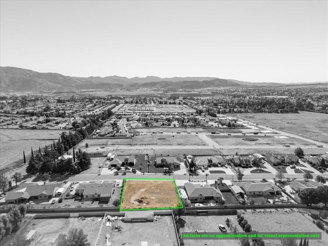 drone / aerial view featuring a mountain view