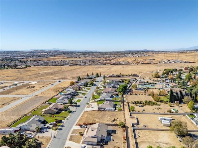 birds eye view of property featuring a mountain view