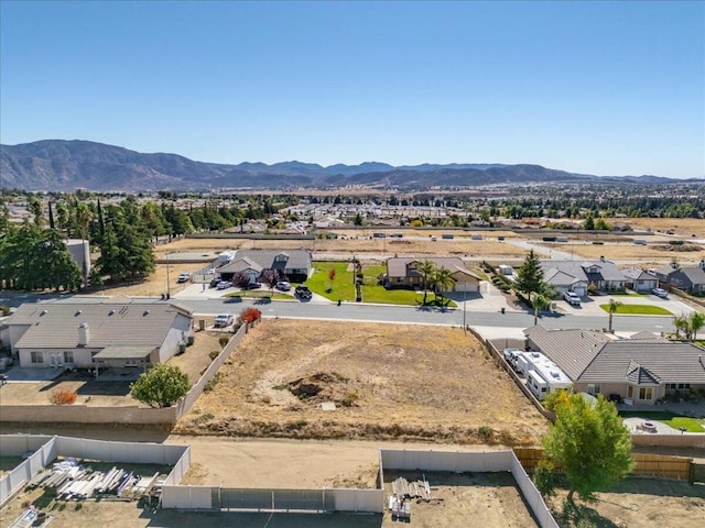 birds eye view of property featuring a mountain view