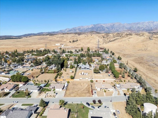 birds eye view of property featuring a mountain view