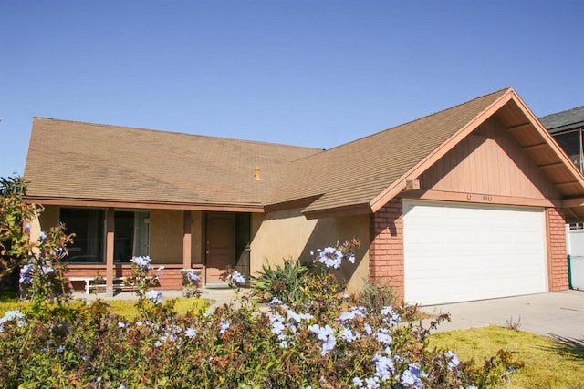 view of front of house featuring covered porch and a garage