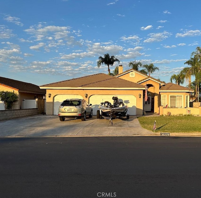 single story home with a garage