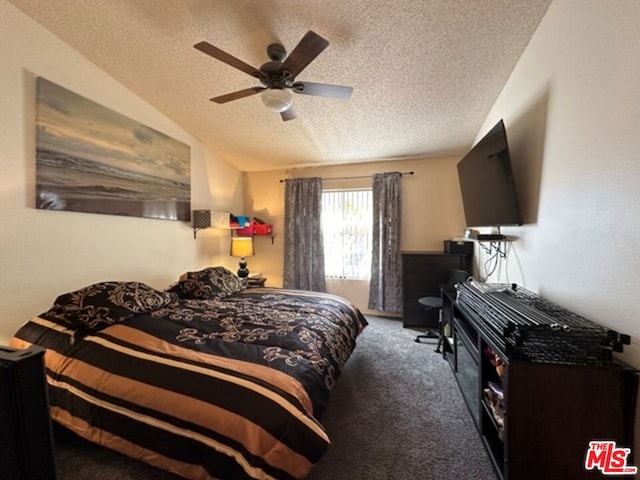 carpeted bedroom with ceiling fan and a textured ceiling