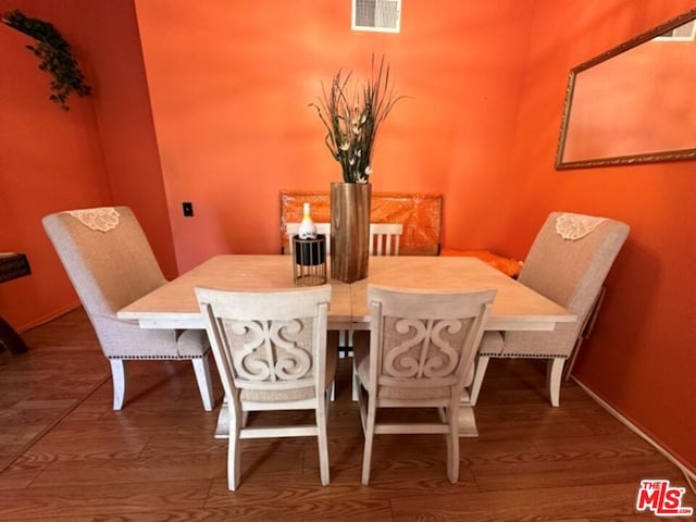 dining area featuring wood-type flooring