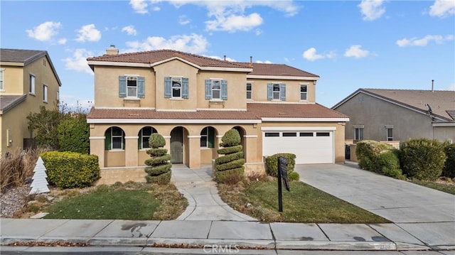 mediterranean / spanish house with a garage