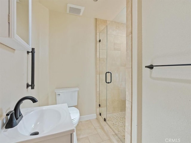 bathroom with walk in shower, vanity, toilet, and tile patterned flooring