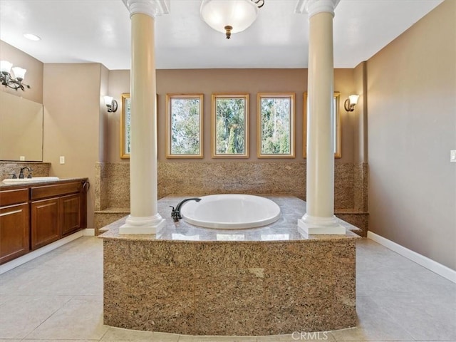 1450 Sugar Bush Ct, Arroyo Grande, CA 93420 - full bath with ornate columns, vanity, a bath, tile patterned floors, and baseboards