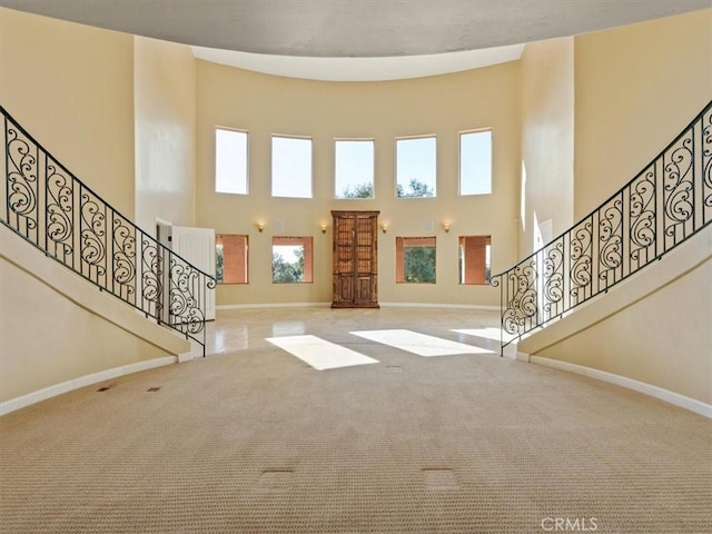 1450 Sugar Bush Ct, Arroyo Grande, CA 93420 - carpeted entrance foyer with baseboards, stairway, and a high ceiling