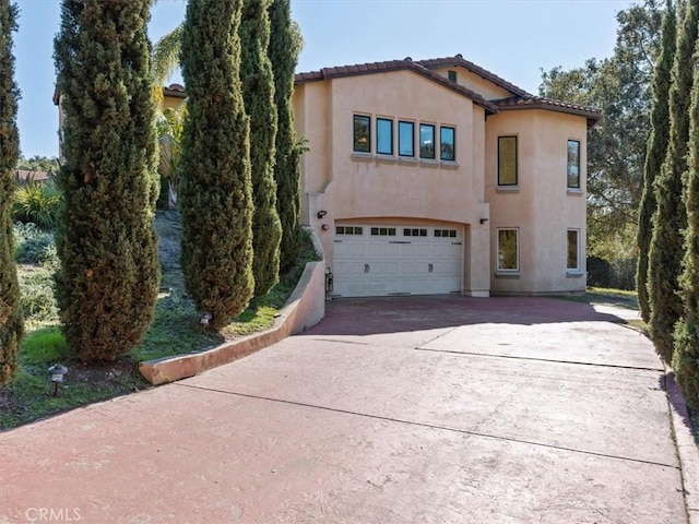1450 Sugar Bush Ct, Arroyo Grande, CA 93420 - mediterranean / spanish-style house featuring concrete driveway, an attached garage, stucco siding, and a tile roof