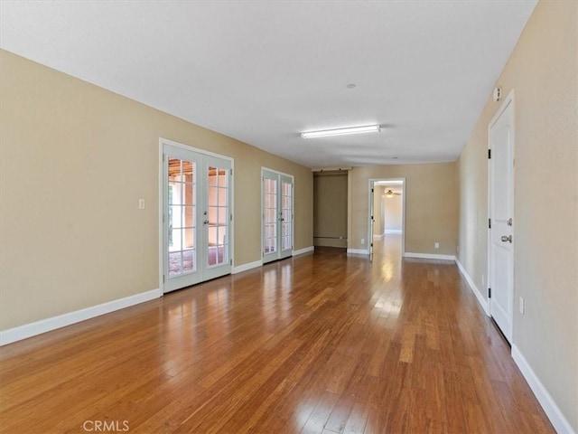 1450 Sugar Bush Ct, Arroyo Grande, CA 93420 - spare room featuring french doors, wood finished floors, and baseboards