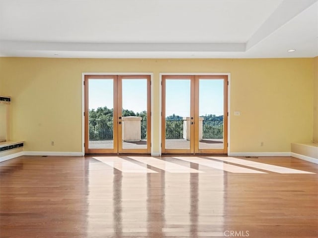 interior space with light hardwood / wood-style floors and french doors