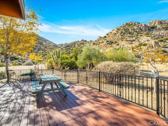 wooden terrace featuring a mountain view