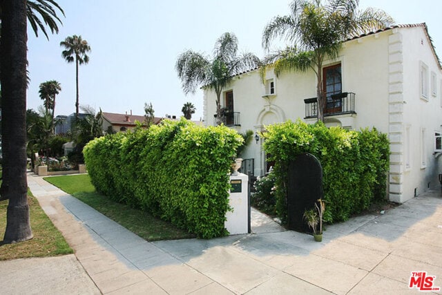 view of home's exterior featuring a balcony