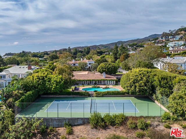 view of sport court with a mountain view