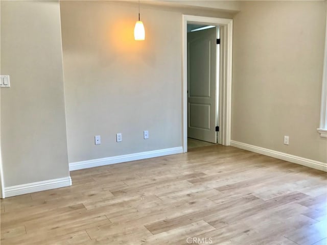 unfurnished room with light hardwood / wood-style floors