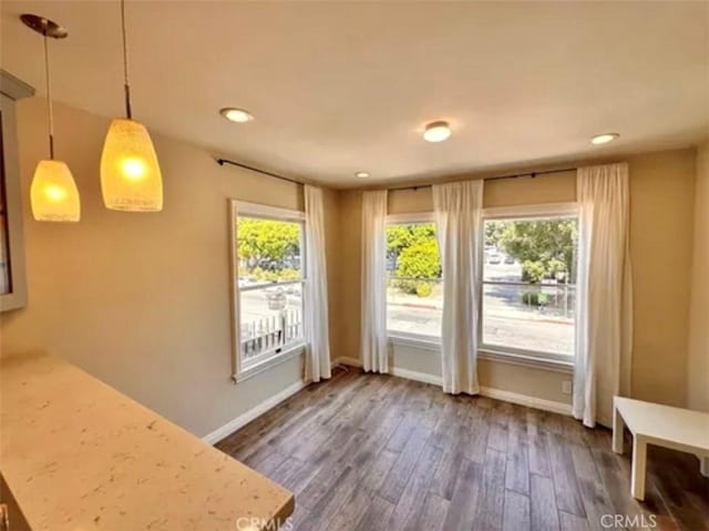 doorway to outside featuring dark hardwood / wood-style floors