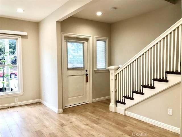 entryway with light wood-type flooring and plenty of natural light