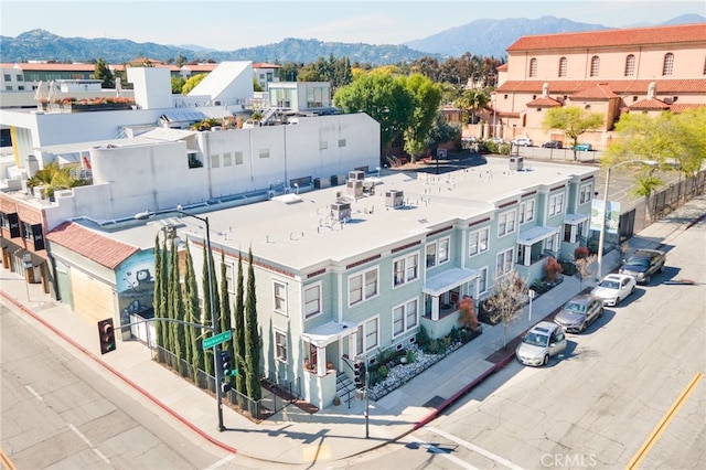 birds eye view of property with a mountain view